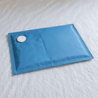 geli insert filled placed on white bed comforter